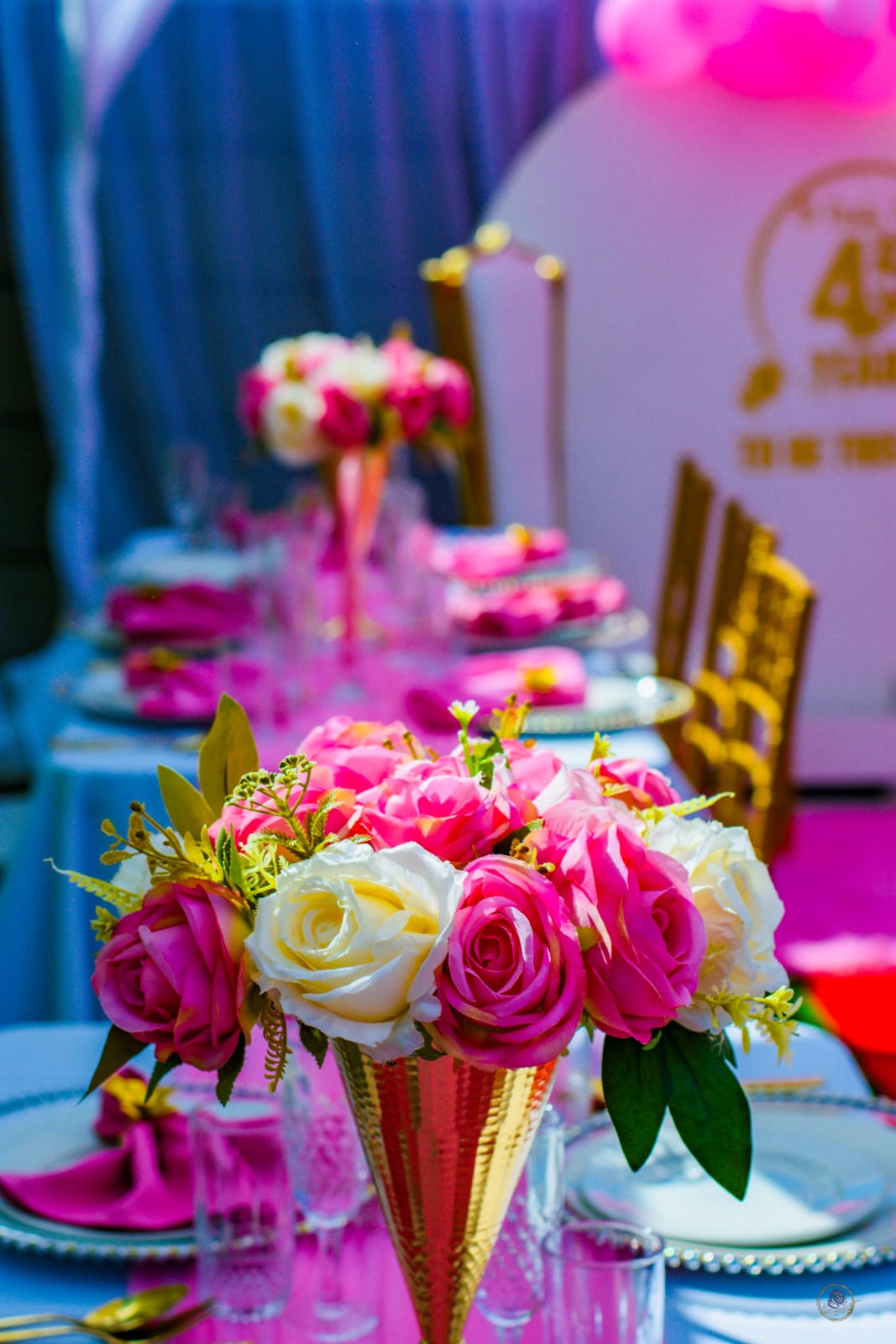 Pink rose centerpiece at a milestone party