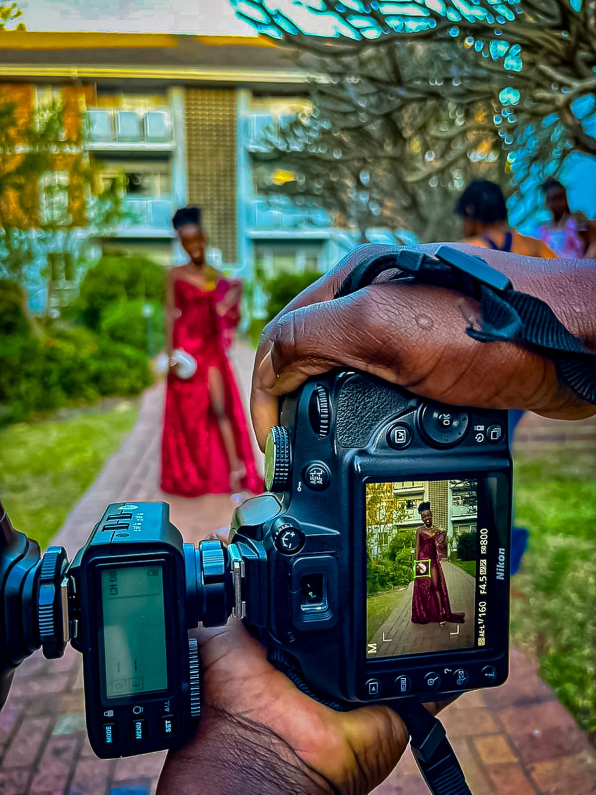 Photographer behind the camera at a shoot